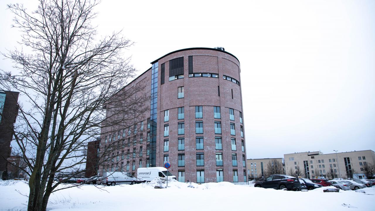 Wintery landscape and apartment buildning