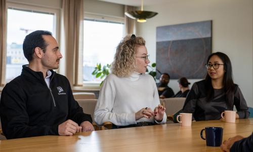 PhD students sitting at a table