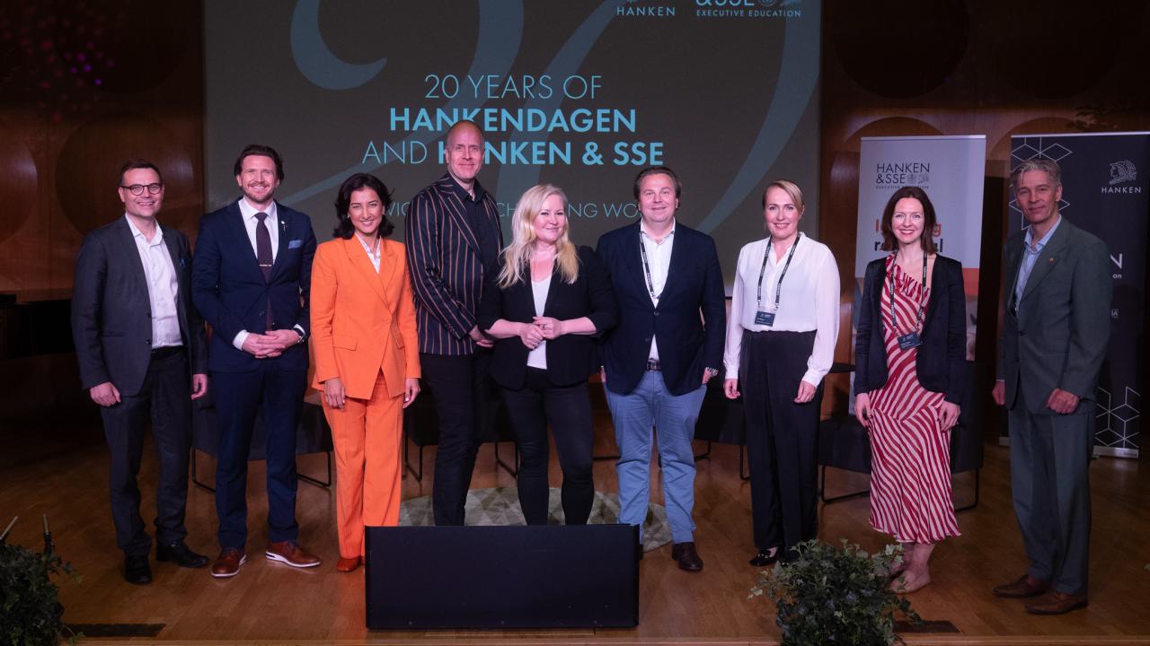 The speakers at Hankendagen standing in line at the stage in the Hanken Assembly hall