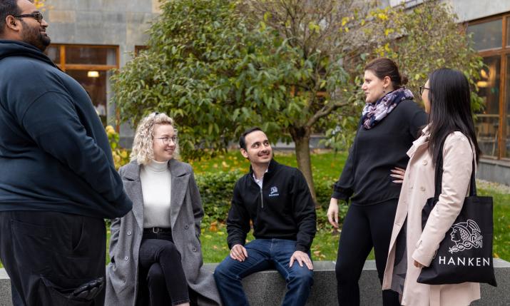 Doctroal Researchers outside of the main building