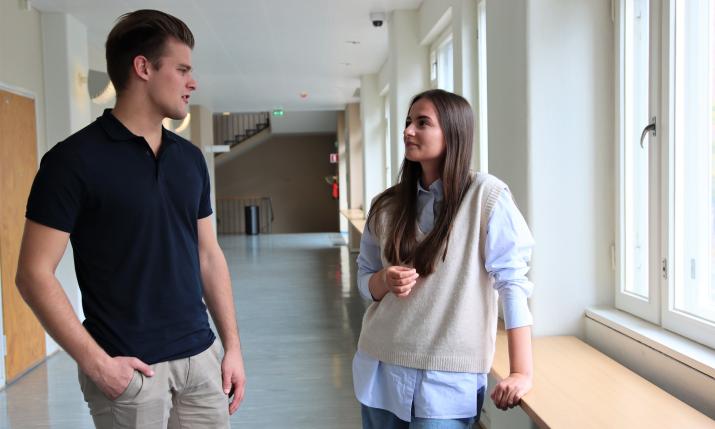 Two students talking to each other