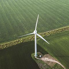 A wind turbine on a green field