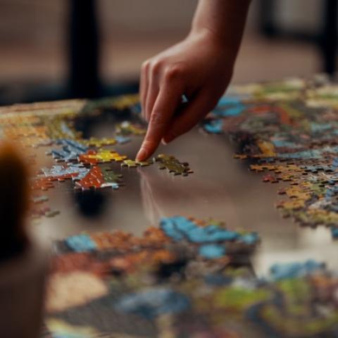 A puzzle and a hand