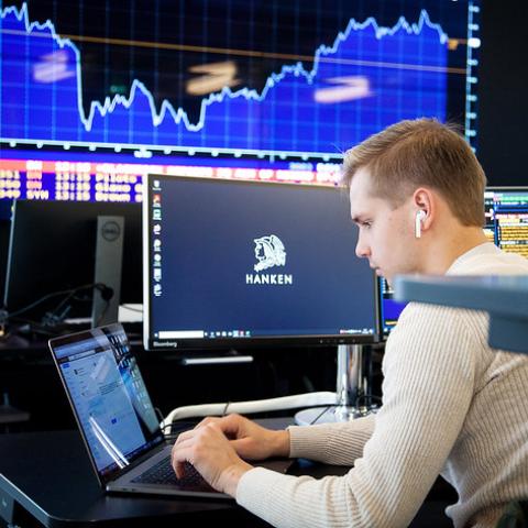 Student working on laptop in Quantum
