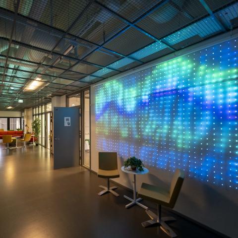 Joint startup space in Vaasa, chairs and a table, light reflecting on the wall